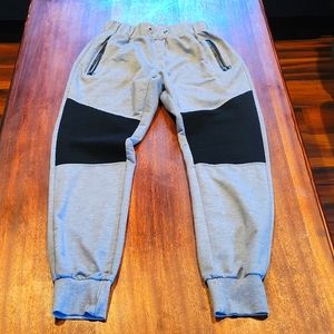 Mens size S gray and black sweatpants with zipper pockets.